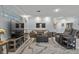 Comfortable living area with a plush gray sofa and stylish marble-patterned rug at 734 Canberra Rd, Winter Haven, FL 33884