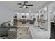Spacious living room with open layout, adjacent bar area, and cozy seating arrangement at 734 Canberra Rd, Winter Haven, FL 33884