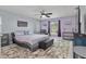 Main bedroom featuring a ceiling fan, sitting area and a king sized bed at 734 Canberra Rd, Winter Haven, FL 33884