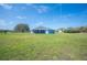 View of spacious backyard, ideal for outdoor enjoyment and activities; features a covered patio at 9461 Redhawk Bend Ln, Lakeland, FL 33810