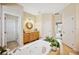 A bathroom with a large soaking tub, wood cabinets and granite counters at 9461 Redhawk Bend Ln, Lakeland, FL 33810