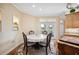 Dining area with table and chairs, next to french doors with backyard view at 9461 Redhawk Bend Ln, Lakeland, FL 33810