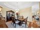 Traditional dining room featuring a dark wood table, hutch, and elegant décor at 9461 Redhawk Bend Ln, Lakeland, FL 33810