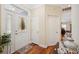 Inviting foyer with a glass-paneled front door and wood flooring at 9461 Redhawk Bend Ln, Lakeland, FL 33810