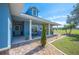 Charming front porch with stone accents, seating area, and manicured landscaping at 9461 Redhawk Bend Ln, Lakeland, FL 33810