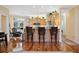 Kitchen with stainless steel appliances, wooden cabinets, hardwood floors and breakfast bar at 9461 Redhawk Bend Ln, Lakeland, FL 33810