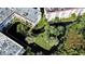 Aerial view of the complex highlighting its building layouts, landscaping, and water features at 1100 Martinique Dr # 106, Winter Haven, FL 33884