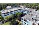 Aerial view showcasing the building's architecture, surrounding landscaping, and waterway features at 1100 Martinique Dr # 106, Winter Haven, FL 33884