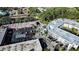Aerial view of the property, parking, and surrounding tree coverage at 1100 Martinique Dr # 106, Winter Haven, FL 33884