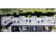 Aerial shot showcases the building's rooftop with various HVAC systems and parking spaces at 1100 Martinique Dr # 106, Winter Haven, FL 33884