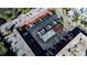 Overhead view shows building's parking layout with multiple vehicles, landscaping, and roof details at 1100 Martinique Dr # 106, Winter Haven, FL 33884