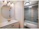 The bathroom has nice features including tiled shower, updated lighting and fixtures, and a sink at 1100 Martinique Dr # 106, Winter Haven, FL 33884