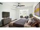 This cozy bedroom provides a peaceful retreat with a large bed, closet space, and comfortable seating area at 1100 Martinique Dr # 106, Winter Haven, FL 33884