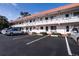 The exterior of this multi-Gathering home features balconies, assigned parking and meticulously maintained landscaping at 1100 Martinique Dr # 106, Winter Haven, FL 33884