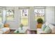 The well lit and newly staged sun room has a seating area overlooking a green space at 1100 Martinique Dr # 106, Winter Haven, FL 33884
