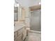 Neutral bathroom featuring a glass enclosed shower and a white vanity with a marble countertop at 1103 Country Club Dr # A-3, Lake Wales, FL 33898