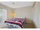 Bright bedroom includes carpet, closet, ceiling fan, and a window at 1103 Country Club Dr # A-3, Lake Wales, FL 33898