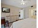 Bedroom boasting a television on the wall and an ensuite bathroom at 1103 Country Club Dr # A-3, Lake Wales, FL 33898