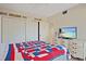 This bedroom features white walls and ceiling, as well as closet space at 1103 Country Club Dr # A-3, Lake Wales, FL 33898