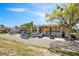View of exterior of building with assigned parking spots and balconies at 1103 Country Club Dr # A-3, Lake Wales, FL 33898