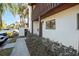 Charming condo exterior featuring a quaint entrance, garden area and well-maintained grounds at 1103 Country Club Dr # A-3, Lake Wales, FL 33898