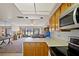 Kitchen provides a view into the living area with plenty of lighting at 1103 Country Club Dr # A-3, Lake Wales, FL 33898