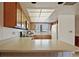 Kitchen showcases plenty of counter space, wooden cabinetry, and a window over the sink at 1103 Country Club Dr # A-3, Lake Wales, FL 33898