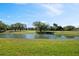 Beautiful pond with lush landscaping at 1103 Country Club Dr # A-3, Lake Wales, FL 33898