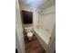 Standard bathroom with tub-shower, toilet, and dark wood medicine cabinet at 1130 N Lake Parker Ave # E231, Lakeland, FL 33805