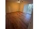 Cozy bedroom with wood-look flooring and sliding doors at 1130 N Lake Parker Ave # E231, Lakeland, FL 33805