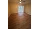 Bedrooom featuring vinyl floors, ceiling fan, and sliding glass door at 1130 N Lake Parker Ave # E231, Lakeland, FL 33805