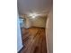 Spacious living room with wood-look floors and ceiling fan at 1130 N Lake Parker Ave # E231, Lakeland, FL 33805