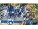 Aerial view of the roof showing its condition, plus a car on the driveway at 1325 4Th Ne St, Winter Haven, FL 33881
