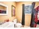 Cozy bathroom featuring classic fixtures and a window for natural light at 1325 4Th Ne St, Winter Haven, FL 33881