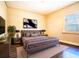 Relaxing bedroom featuring neutral tones, a comfortable bed, and a cozy rug at 1325 4Th Ne St, Winter Haven, FL 33881