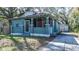 Charming home featuring a screened front porch, classic architectural details, and a detached garage at 1325 4Th Ne St, Winter Haven, FL 33881