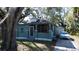 Inviting home exterior with a screened porch, driveway, and manicured front yard at 1325 4Th Ne St, Winter Haven, FL 33881