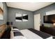 Main bedroom with sleek gray walls, black furniture, and contemporary decor at 1325 4Th Ne St, Winter Haven, FL 33881