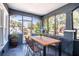 Inviting screened-in porch with comfortable seating and views of the surrounding neighborhood at 1325 4Th Ne St, Winter Haven, FL 33881
