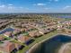 This desirable home, featuring a screened-in enclosure, is perfectly positioned alongside a picturesque waterway in a lush community at 1336 Oakmont Dr, Winter Haven, FL 33884