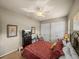 Comfortable bedroom features a ceiling fan and double closets at 1336 Oakmont Dr, Winter Haven, FL 33884