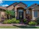 Close up of the front of the home featuring a beautiful front door and lush landscaping at 1336 Oakmont Dr, Winter Haven, FL 33884