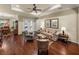 Spacious living room with tray ceilings, hardwood floors, and decorative furniture at 1336 Oakmont Dr, Winter Haven, FL 33884