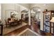 Open-concept formal dining room with hardwood floors, archways, and decorative furniture at 1336 Oakmont Dr, Winter Haven, FL 33884