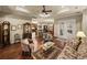 Open-concept living room with hardwood floors, tray ceilings, and decorative furniture throughout at 1336 Oakmont Dr, Winter Haven, FL 33884