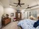 Bedroom featuring tray ceilings, ceiling fans, decorative furniture, and carpeted floors at 1336 Oakmont Dr, Winter Haven, FL 33884