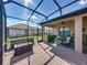 Beautiful outdoor lanai with lake views, kitchen, and outdoor seating at 1336 Oakmont Dr, Winter Haven, FL 33884