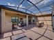Spacious patio with outdoor seating, kitchen, dual ceiling fans, and beautiful lake views at 1336 Oakmont Dr, Winter Haven, FL 33884