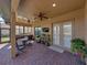 Enclosed patio featuring brick floors, a grilling station, outdoor seating, and plants at 1336 Oakmont Dr, Winter Haven, FL 33884
