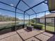 Screened-in lanai with relaxing lake views and outdoor seating at 1336 Oakmont Dr, Winter Haven, FL 33884